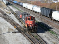 With CN 385 working on the main building its train in the "A" yard at Sarnia, a yard job works away at the never-ending task of sorting cars in the "C" yard which mostly supports the local industries in Sarnia.