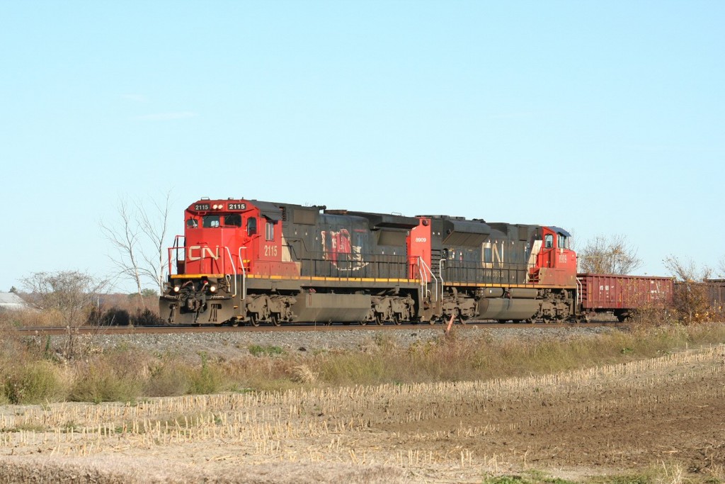A pair of relatively new, but already grubby looking, acquisitions including 2155 in the 15th Anniversary (of the privatization of CN) paint scheme head up CN 331 on November 5, 2011.