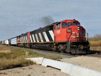 SD60Fs 5551 and 5555 lead Calgary bound CN 442 south on the Camrose Sub.