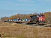 IC 2724 trails Roberts Bank bound CN 101 as it travels west through Uncas.
