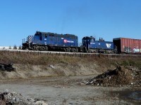 GP9 124 and SW900 901 approach the Fraser River Swing Bridge.
