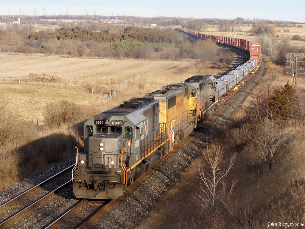 Eclectic lash-up consisting of a Wisconsin Central SD40-2, a UP SD70 and a GE-Alsthom SD40-3 leads CN train 149 approaching Newtonville Road on the Kingston sub.