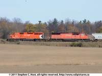 Canadian Pacific 6013 west is rolling by grain fields in Puslinch Township, Ontario with trailiung unit CP SD40-2F 9003 on CP train 441.