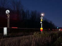Here's a lame dame photo, CN 399 screams downhill knocking down the advance signal to Mansewood along Canadian National's Halton Subdivision, the yellow over red flag taped to the signal mast indicates a rule 42 work block up ahead (the red flag is 2 miles away which is the start of the working limits) where trains must call the foreman in charge for permission through their working limits. Another feature added is the directional arrow just below the restricting plate, this feature (when you're lined up) helps train crews on knowing which track they'll be placed on when they come up to the controlled location, when flashing it means you are lined up onto the north track, when not flashing you are lined up the south track. 