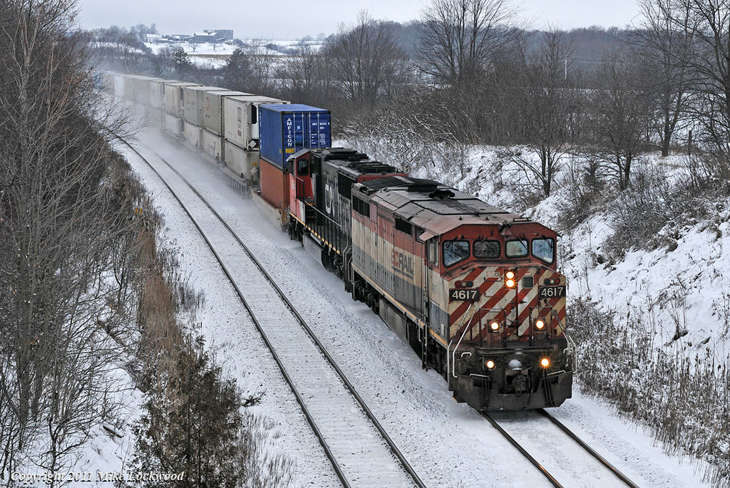 With 106\'s train in tow, BCOL 4617 and CN 5665 roll downgrade approaching Port Hope. 1331hrs.