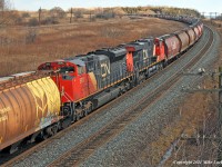 Grain train 874's mid train DPU, consisting of CN 2247 and 8910, lend their support to the headend power (CN 2320 and 5768) in moving the 155 car, 22000 tonne train east. 1433hrs.