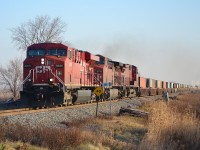 CP 241 led by a trio of GE's, heads westbound past mile 76 on a chilly December morning.