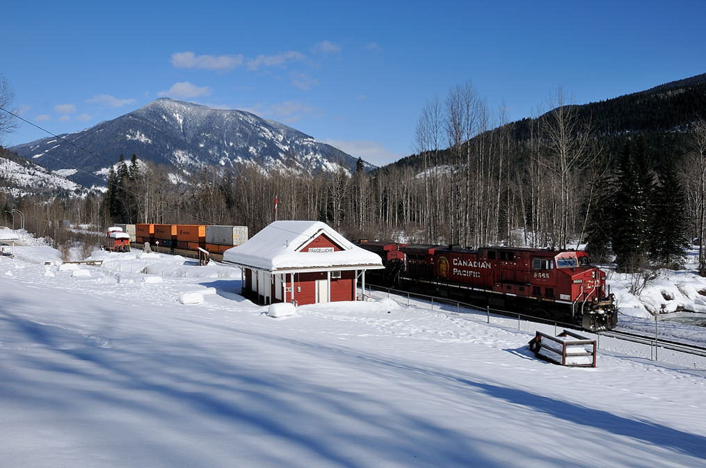 During my time working the \"BC Interior Service Area\" during the winter of 2010/11 I made it out on a rare sunny day to capture this westbound hot shot, CP 9665 West rolling past the site of the \"First Spike\".