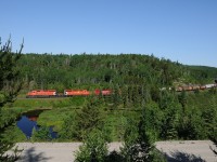 Coasting down through the S-curves at Mileage 47 on the CP Kaministiquia Sub west of Thunder Bay, train 222 lead by a quartet of SD40-2's (6041-5759-6602-5866) lead their train mostly made up of Thunder Bay grain downgrade.