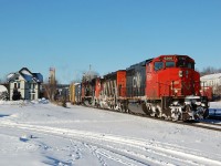 A pair of vetern SD40-2W's and new SD70M-2 lead this eastbound freight past the passenger station in Woodstock, Ontario. CN 5266-CN 5348-CN 8019.