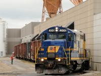 The crew of GEXR 580 spots a string of boxcars at the MBI Smurfit cardboard plant off the "North Industrial Spur" in Guelph. Power for this local was RLK GP9u 4001 and LLPX GP38-2 2236.