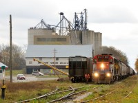 It's train time in Clinton as the conductor off GEXR 433 heads to knock the derail off to set one grain hopper in the back track. This is today's local for the Exeter Sub, once back on their train they will head south at Clinton Jct to spend a couple hours switching Hensall then down to the end of track at Centralia to spot the P&H elevator and get relieved. Power this day was RLK GP35 2211 and LLPX GP38-2 2236.