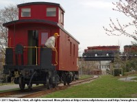 Goderich and Exeter train 432 is heading east on the Guelph viaduct as Bruce from the Guelph Historical Railway Association looks on. The GHRA had their 1941 Canadian Pacific Caboose on the Guelph Junction Railway mainline for the weekend for Doors Open Guelph. The GHRA is presently in the midst of a $10,000 restoration of this Caboose, for more photos or information visit http://www.ghra.ca