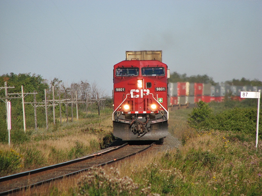 CP 9801 is passing milepost 87 on the Broadview Subdivision with train 102.
