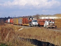 After switching an Industry on Tapscott road a derailment occurred on the Havelock Sub with both siding and track blocked it left T07 stranded at Passmore Ave.A Hi-rail truck was attempting to raise the cars as CP staff looks on.