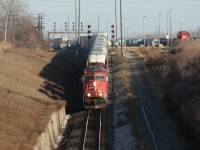 CN 393 heads downhill out of Sarnia yard to the St Clair Tunnel to Port Huron, Michigan with an SD75i, ex-BNSF C40-2W and an SD40u.