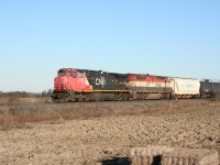 CN 331 with a C44-9WL from CN's first order, with the unique Canadian-style safety cab, and a full-carbody BC Rail C40-8CM approaches its destination at Sarnia on Boxing Day, 2011.