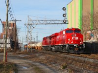 A crisp-looking CP 8903 leads a Chicago (BRC)- Toronto 244-16 past the signal mast at Osler ave.