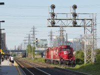 CP 8212 and STLH 8225 sink into the grass as they stroll down the South Service to lift 68 axles worth of train for Toronto Obico.