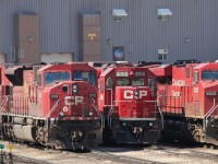 CP 9119 SD90/43MAC, CP 3065 EMD GP38-2, CP 8820 ES44AC idle at the Winnipeg Diesel Shops