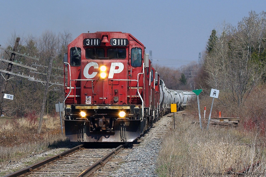 In the same location as previous photo we see the ugly duckling 3111 before its rebuild this year rusty door faded paint the whole bit.