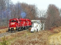 Struggling with 2 ballast hoppers 3114 lets some throttle and meeting with a service van in the wilds of Pickering.