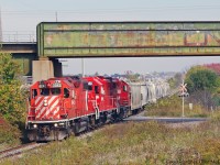 T07 with a small load of 12 cars is seen passing under the CN York sub in Markham.Illustrating my earlier point one can see farms and suburbs in the one location.