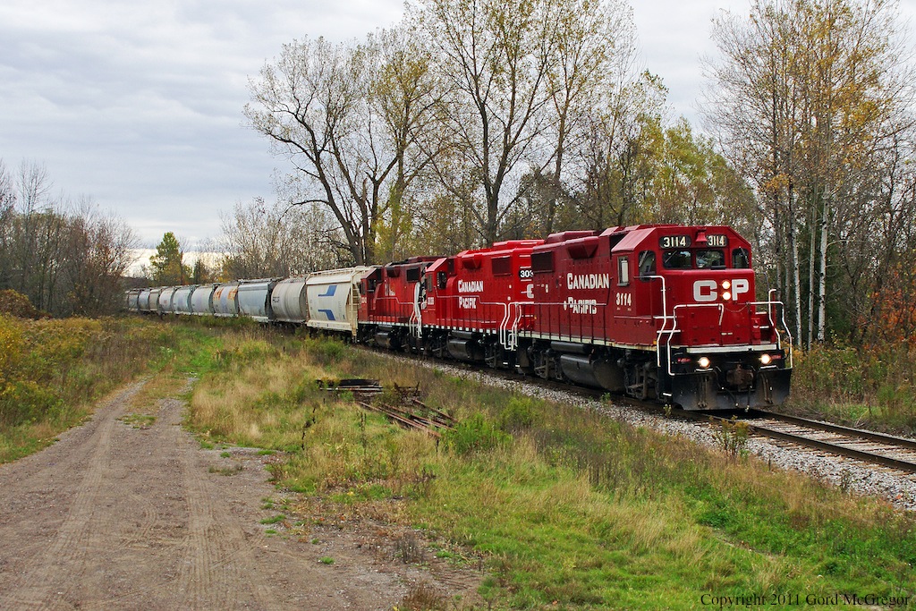 T07 running the long curve in Myrtle Station the area is very open as it used to be a busy point on the Ontario & Quebec Railway with several tracks station and mill.