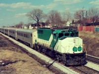The first twelve years or so GO Transit was a rather modest operation, Lakeshore route Pickering to Oakville only. Ten car GO Trains were week day rush hour only, off peak and weekend service was  sparsely patronized and handled by two or three car self propelled Hawker Siddeley built units ( pics out there by anyone?) numbered in the 'D' series (D100 to D108). At that time almost all GO equipment was new, except for the rebuilt ACPU ex ONR F units, so with GO basically uninteresting these negatives were exposed while waiting for Via CN Rapidos', Bonaventures', Execs', Capitals' powered by  Cab Units: FPA4's and FP-9A's that could be in either new Via colours or even better in the CN stripes – by far more interesting. So for a spring Saturday operation these ten car Go Trains was a surprise. The reason for the Saturday (and Sunday) rush hour sized trains: increased patronage generated due to the new Major League Baseball team's home games at Exhibition Stadium – the rest of course is history but certainly credit the Major League for the public discovering the convenience of using GO for pleasure travel, in addition to the standard daily Monday to Friday business travel grind. The hourly GO schedule provided a 'meet' between Danforth and Scarborough Stations, so these negatives (compete with unexpected colour shift – minor correction attempted) with 700 and 901 leading respective westbound and eastbound trains were exposed June 1977, only minutes apart, near the top of the Scarborough grade (eastbound uphill). And this GO equipment is not new now, it is history. So, the first twelve years or so of GO looked like this. ASA100 Kodak colour negatives transported by a Nikon Nikkormat EL. Photographer S. Danko.