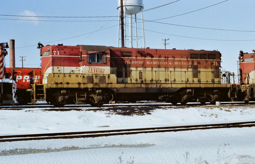 By 1980 TH&B power, after three plus years under full CP Rail ownership, was looking weary (ie very distinctly CP-ish). Here TH&B GP-7 #71, reportedly the first diesel delivery by the new ( in 1954) GMDD London Ontario plant, awaits next assignment at CP Agincourt. Unfortunately #71 was wrecked in a February 1980 grade crossing mishap. January 1980 Kodak Kodacolor II ASA100  negative transported by a Nikon Nikkormat EL. Photographer S. Danko.