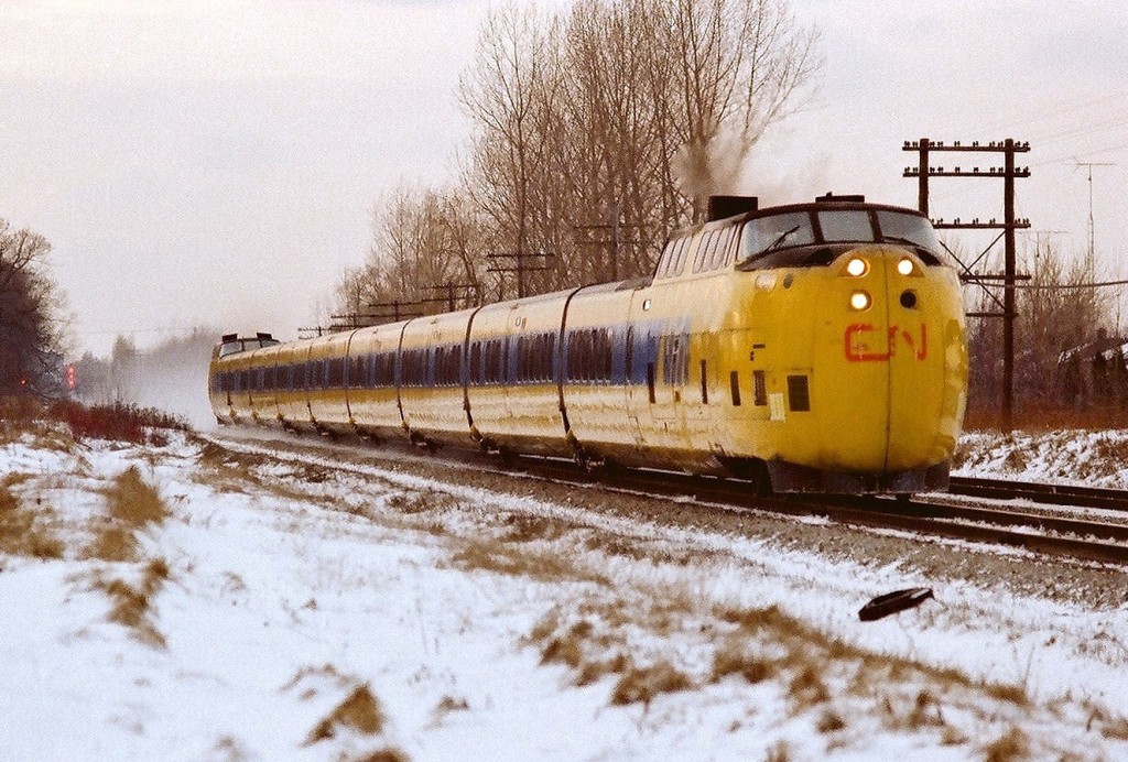 Eastbound at track speed. On approach to CN Port Union (today near Rouge Hill ). Guildwood crossovers in the back ground. At that time simply fast. Kodak Kodacolour II, ASA 100 negative, photo by S.Danko.