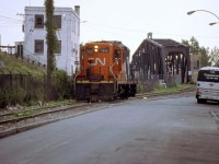 CN 4216 back from the harbor on the old rugged track about to cross the canal on the old swing bridge,now a new track & bridge have been built in 1991 and this bridge is secured open for the boats.