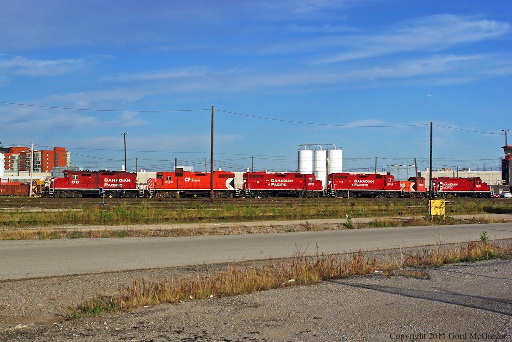 Surprises are nice.Looking at some new angles to shoot the yard ended up seeing The Havelock Consist picking up their GP-9 8216 from the locomotive storage area
