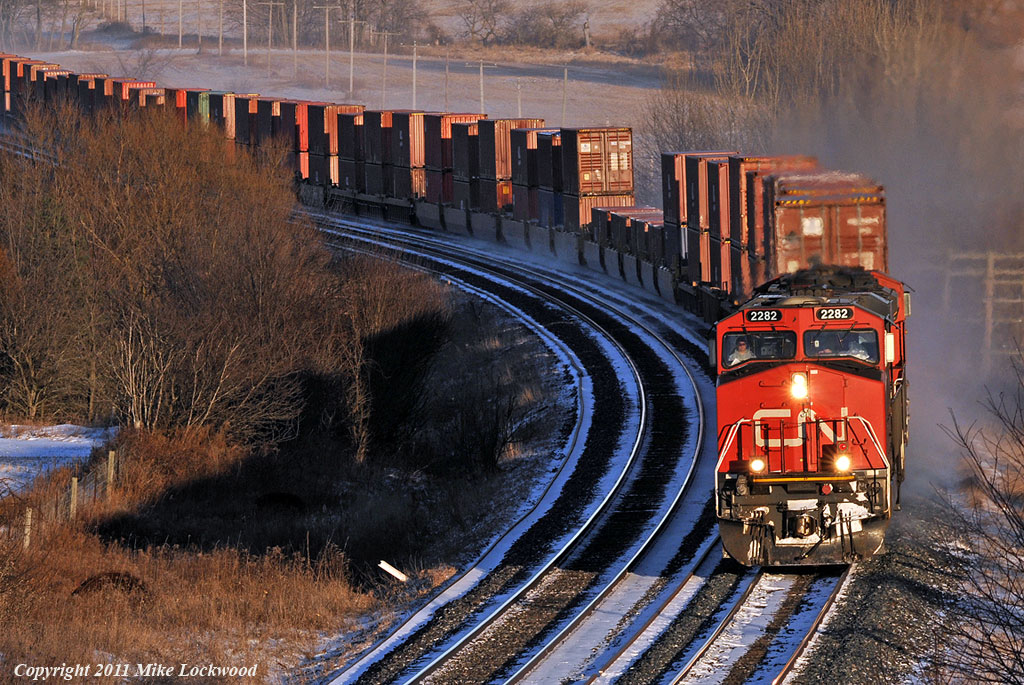 CN 2282 and 8850 have train 149 well in hand at Newtonville. 1611hrs.