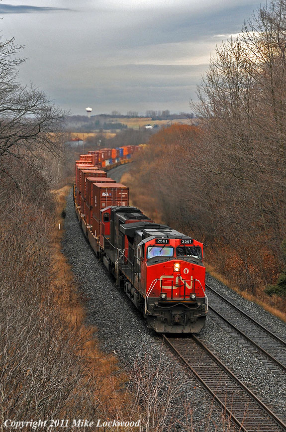 CN 2561 and 5711 are well into the pull up to Newtonville with 149\'s train. 1319hrs.
