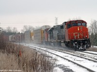 Headlights dimmed, CN 368 behind CN 5362, GTW 5949, and CN 4774 is about to pass the stopped 305 on a blustery late autumn day. Of the four CN freights I caught in a couple hours trackside, this was the only train not lead, or completely powered by, new 8800 series SD70M-2s. Thinking back, this was the real beginning of the end of these types of lashups out on the Kingston Sub, as now just about everything is powered by pairs of 4000-4400 HP locomotives. The stopped 305 not seen in the photo was powered by two of them with a GP38-2 along for the ride. 1434hrs.