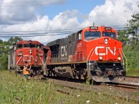 CN work 906 meets Q114 at washago as the crew inspects 114's train