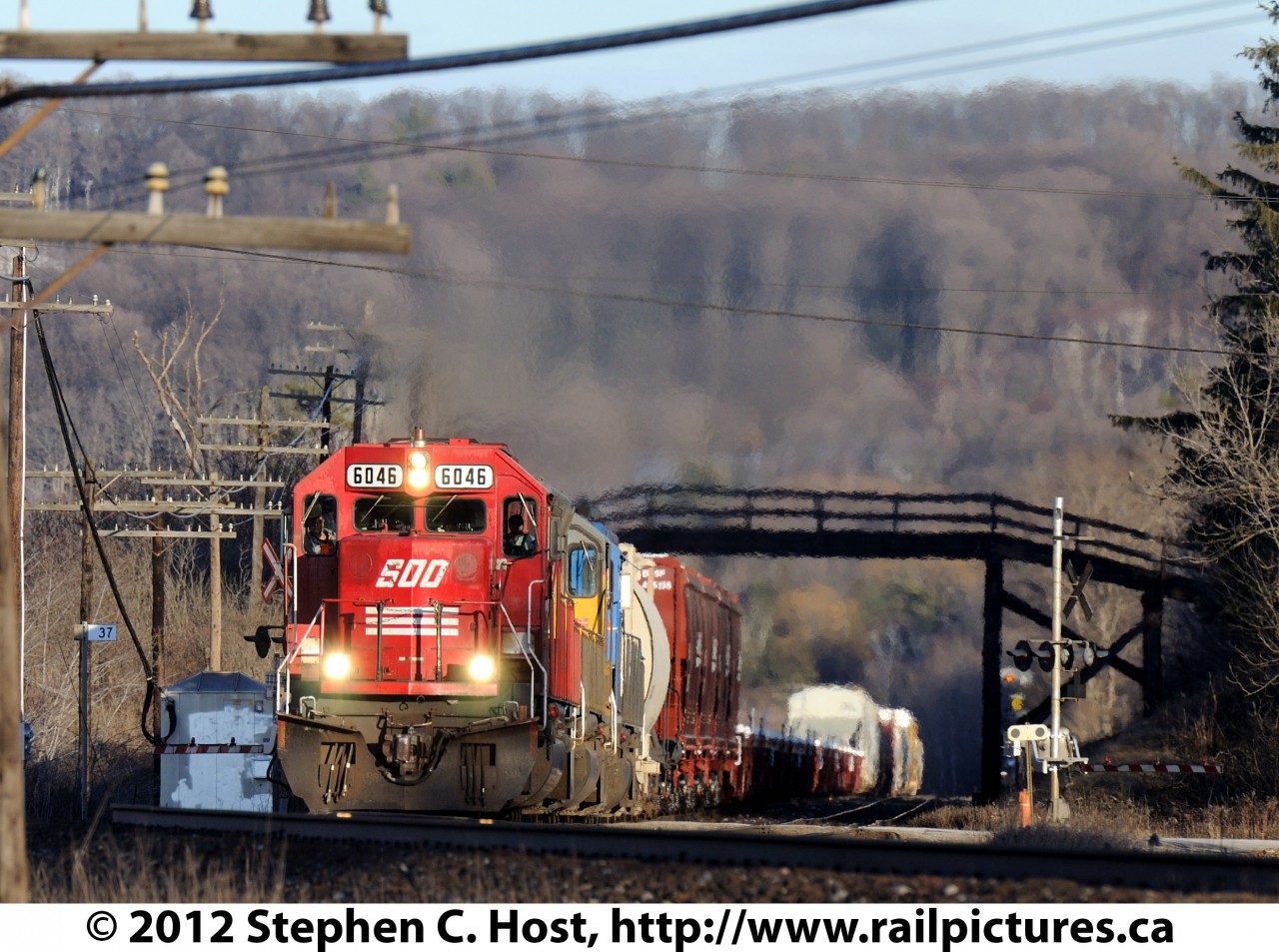 CP 245 with SOO 6046 West is about to crest the Niagara Escarpment at Campbellville