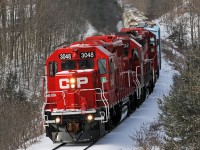 Freshly shopped CP 3048 is out front on T08, trailed by 3032, 3111 and the 16 cars of T08 as they roll through a winter wonderland east of Raglan. 1008hrs.