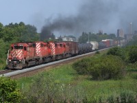 Sometimes luck is on your side... CP 223 train leaves Thunder Bay and an industrial skyline behind.