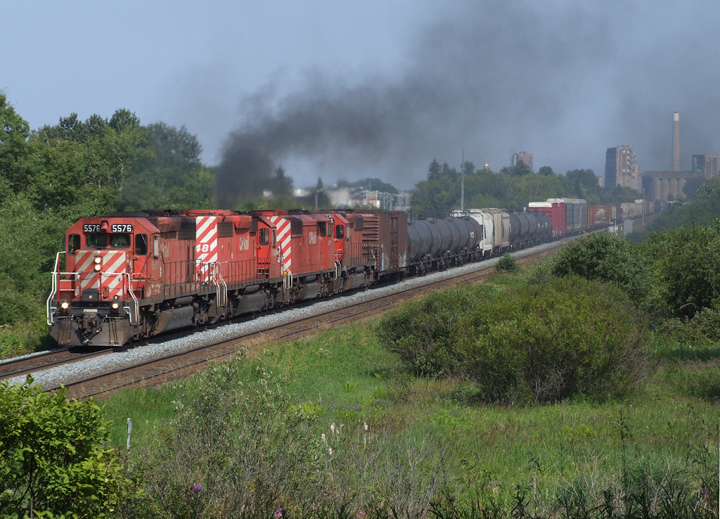 Sometimes luck is on your side... CP 223 train leaves Thunder Bay and an industrial skyline behind.