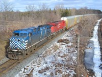 CP 147 led by CEFX 1028 & CP 8809 rounds the bend out of London coming to the Denfield Rd bridge.