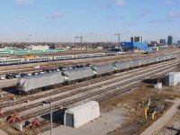 Ten F59PHs sit covered up at VIA\'s TMC yard in Toronto.