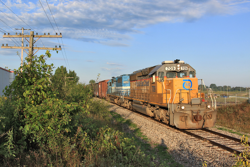 FEC 709 leads a leased GATX unit through Kitchener with 34 cars and a final destination of MacMillan Yard.