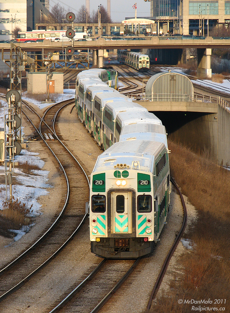 Full of Milton-line commuters leaving Toronto after a long day, GO #157 snakes through the USRC trackage for the Galt Sub. GO cab car 210 is leading the charge at Bathurst St., with F59PH 549 pushing on the rear.