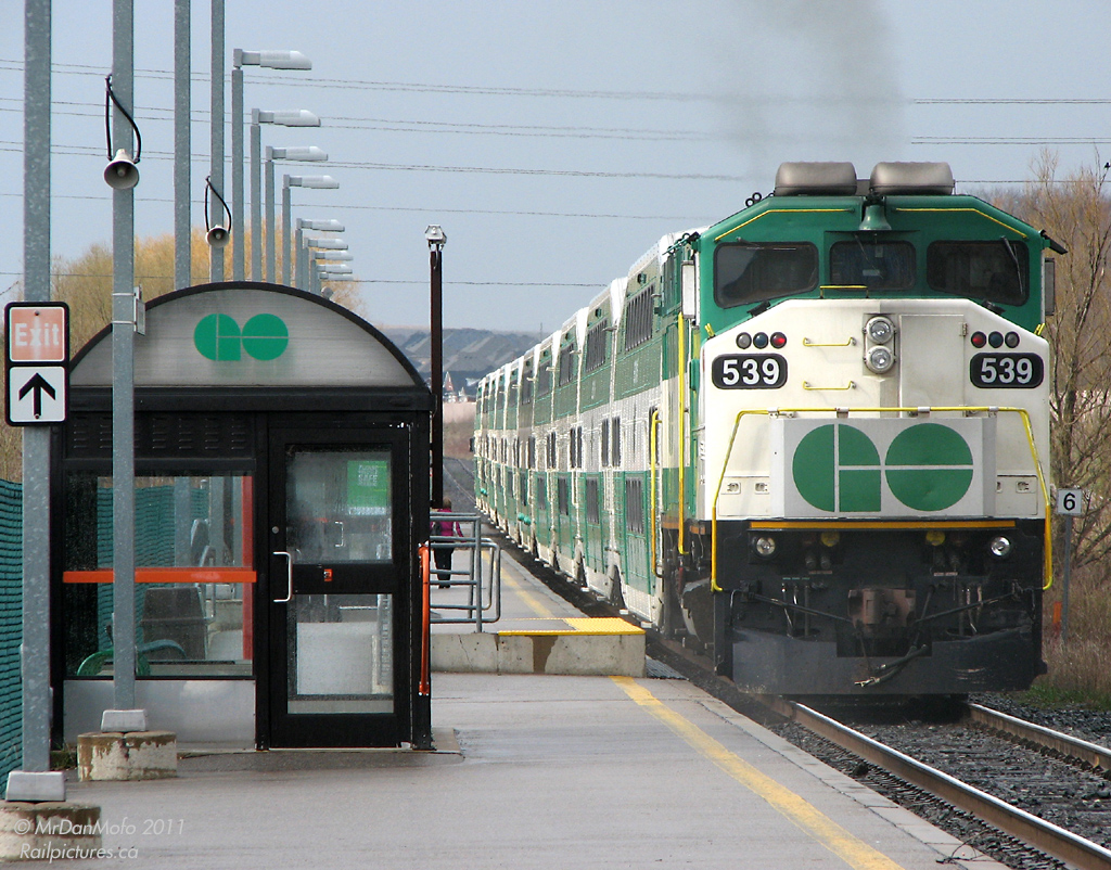 GO 539\'s 710G is working its magic and smoking lightly as she pushes 10 packed cars out of Rutherford GO station on #801. The F59 reign on GO\'s operations was falling, with most of the first order sidelined and sold to RB Leasing. At this exact moment, 6 former GO F59\'s were making their way to nearby MacMillan Yard on CN #422. A little less than a year later, 539 would follow suit; sold to RBRX in March of 2010.