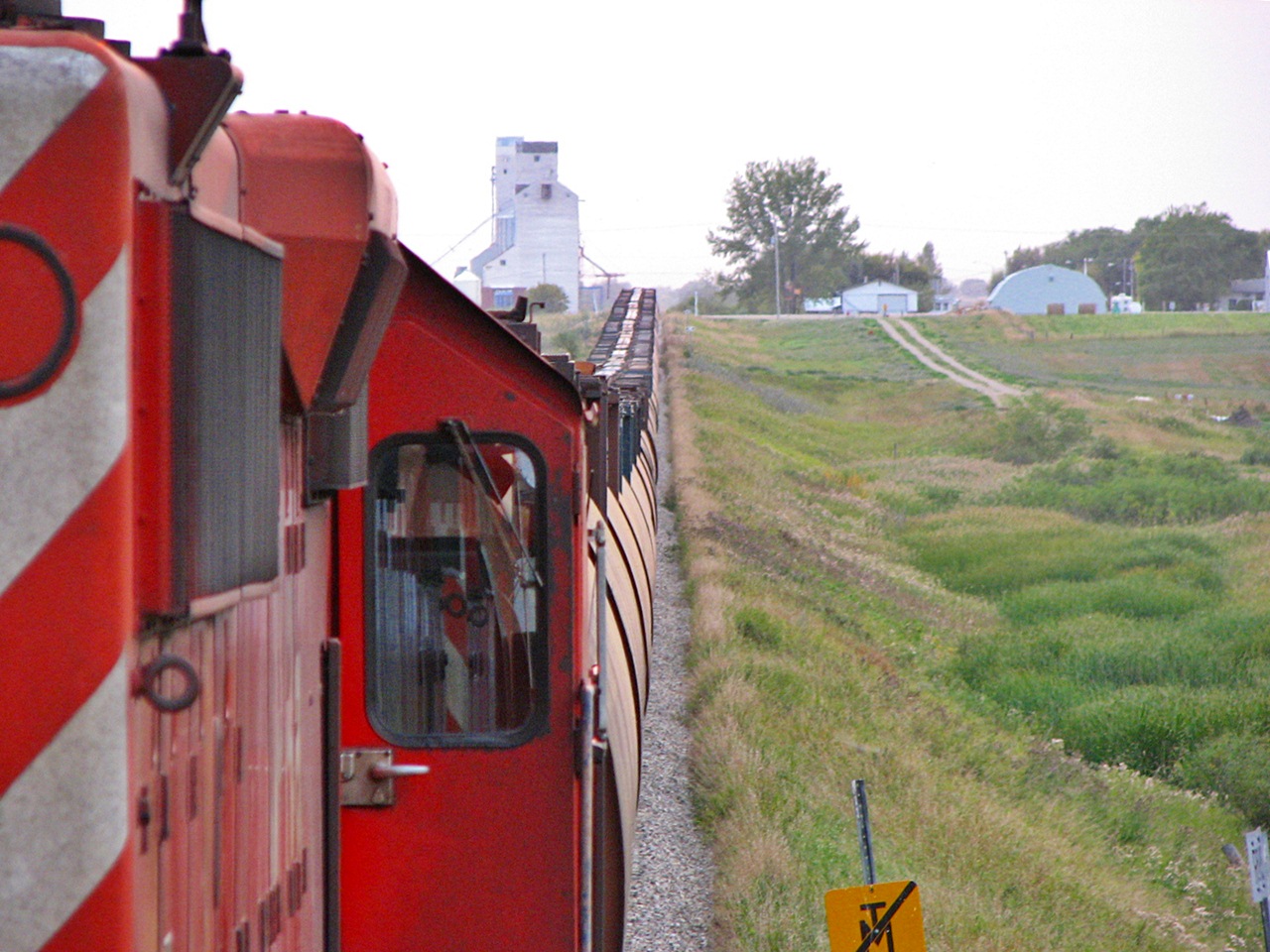 CP SD40-2\'s try to push  grain loads up the hill at Redvers. The line from Redvers to Brandon is like a roller coaster ride and often causes a few kickers.