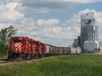 CP P34 working the elevator with the usual three GP38-2 consist.