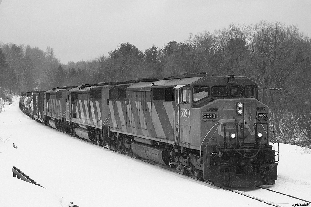 CN A45031 18 - CN 5520 South slowly rides the brakes down the hill into Bracebridge in January of 2008. This assignment now runs at night, but still tends to get nice consists such as this one.