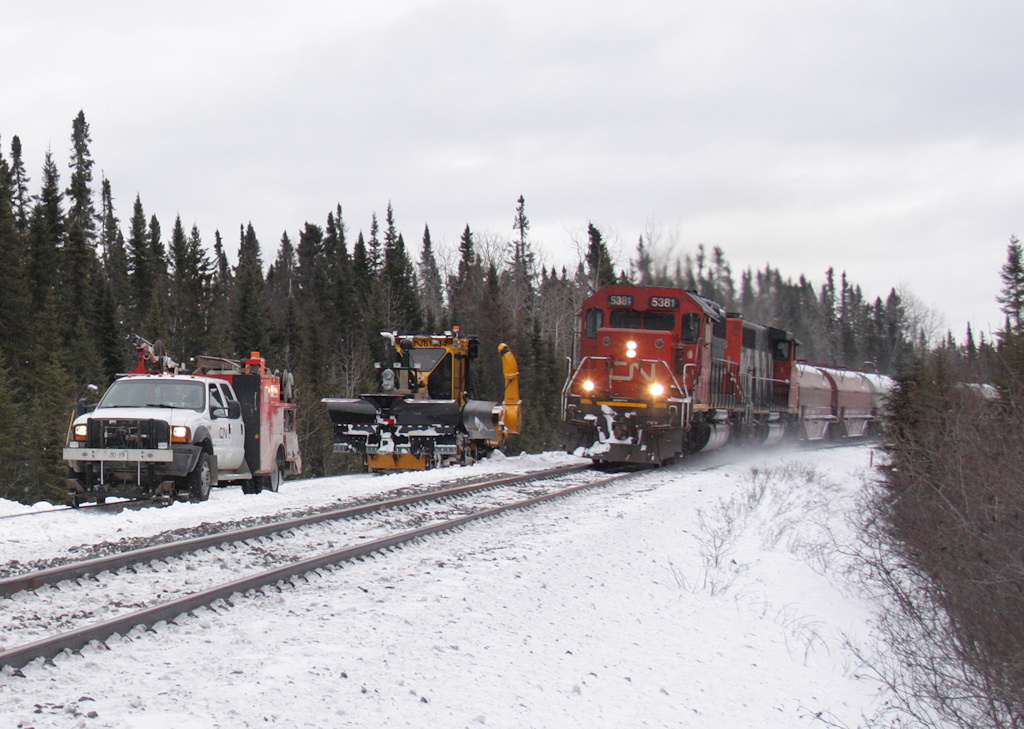 Sharing the road.... Cleared in the siding at MacDuff, CN L520 passes us with a 67 car heavy freight from the CN/ACR